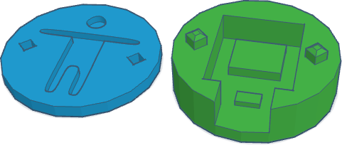 A round object to house a small chip. There is a hole in the middle for the chip, a gap for the USB-C entry, and an indentation of the 'accessibility person' in the cap.